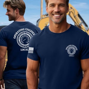 May include: A navy blue t-shirt with a white graphic of an operating engineer's union logo on the front and a larger version of the logo on the back. The logo includes a gauge, the words "Operating Engineers", and "Local 4".