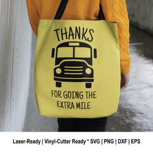 May include: A yellow tote bag with black text that reads "THANKS FOR GOING THE EXTRA MILE" and a black silhouette of a school bus.