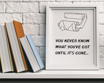 Puede incluir: Una impresión enmarcada en blanco con una ilustración en blanco y negro de un tubo de pasta de dientes que se exprime. El texto en la impresión dice "You never know what you've got until it's gone..."