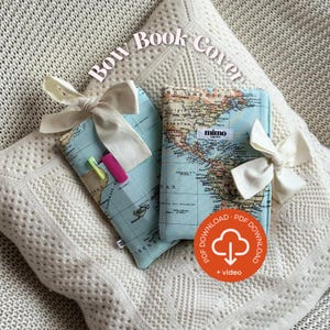 May include: Two book covers with a world map design, tied with cream-colored bows. One cover has a pink and yellow highlighter in the pocket. The text "Bow Book Cover" is at the top. The covers are on a white, textured surface.