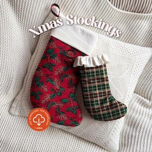May include: Two Christmas stockings. One is red with a green holly pattern and a white cuff. The other is green and red plaid with a white ruffled cuff. The text "Xmas Stockings" is in the image.