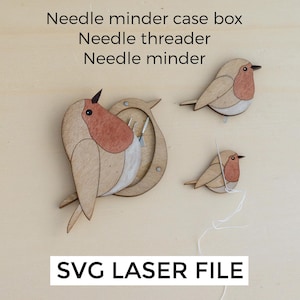 Puede incluir: Agujas y un enhebrador de agujas de madera con forma de petirrojos. Los petirrojos son de color marrón claro con el pecho rojo y el pico negro. El texto "Needle minder case box", "Needle threader", "Needle minder" y "SVG LASER FILE" son visibles.