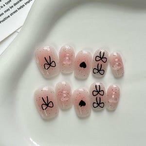 Cute Pink Glitter Press-On Nails with Bow and Heart Design - Handmade and Long-Lasting Nail Art Set