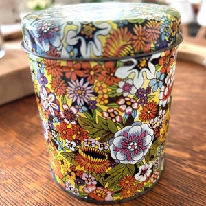 1970s Floral Print Pattern Tin Cylinder Container With Lid 4.5 in Tall Flower Power Print