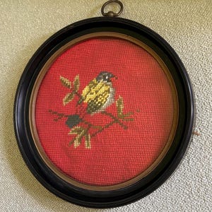 Vintage Framed Needlepoint Bird on Red – Black Round Frame with Glass and Brass Ring – Cottagecore Wall Art – Folk Art Bird Embroidery