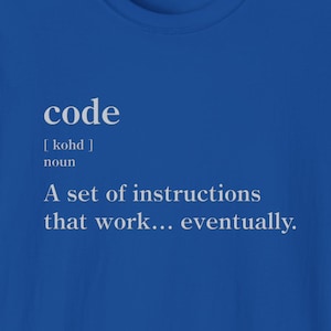 May include: A blue t-shirt with white text that reads "code [kohd] noun A set of instructions that work... eventually."