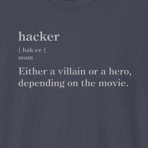 May include: A dark blue t-shirt with the word "hacker" defined as "Either a villain or a hero, depending on the movie."