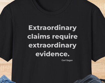 May include: Black t-shirt with the quote "Extraordinary claims require extraordinary evidence" by Carl Sagan in white text. The word "BLACK" is printed at the bottom of the shirt.