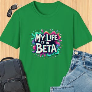 May include: Green t-shirt with a colorful graphic that says "My Life is in Beta".