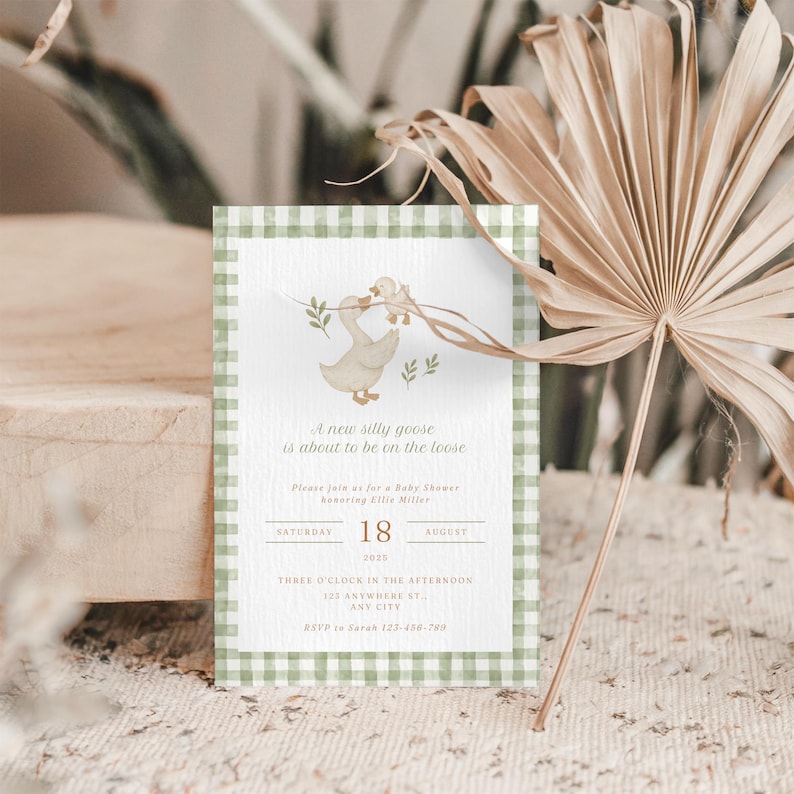 May include: Baby shower invitation with a whimsical goose illustration. The invitation features a green gingham border and includes the text "A new silly goose is about to be on the loose." Details include date, time, and RSVP information.