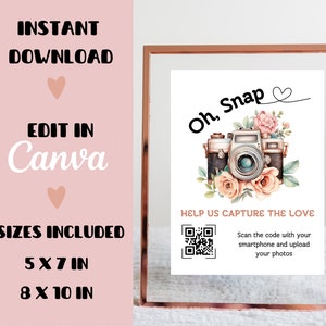 May include: A printable sign with a vintage camera and floral design. The text reads "Oh, Snap" with a heart symbol. The sign also includes a QR code and the text "Help us capture the love. Scan the code with your smartphone and upload your photos."