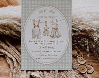 May include: A gender reveal invitation with a light green gingham background. The invitation features an oval design with illustrations of baby clothes and a teddy bear hanging on a clothesline. Text reads "he or she, What will baby be?"