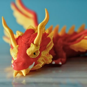 3D Printed Articulating Four-Winged Dragon – Flexible & Customizable Fidget Toy