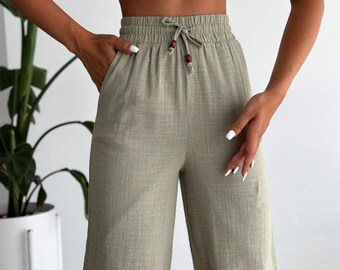 Linen women's palazzo trousers, half-lined, laced, with pockets