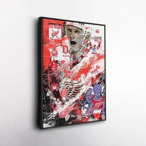May include: Framed artwork featuring a collage of Detroit Red Wings imagery. The design incorporates a hockey player, team logos, and a cartoon octopus. Dominant colors are red, white, and black, with a distressed, textured effect.