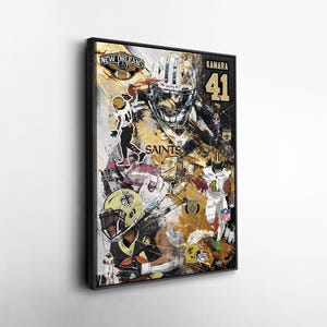 May include: Framed artwork featuring a collage of New Orleans Saints football players. The artwork includes the team's logo, player images, and the number 41. The color scheme is black, gold, and white.