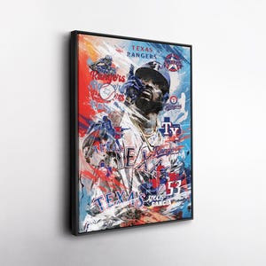May include: A framed art print featuring a baseball player in a Texas Rangers uniform. The artwork uses a vibrant mix of red, blue, and white with the words "Texas Rangers" and the player's name and number. The image has a dynamic, action-oriented feel.