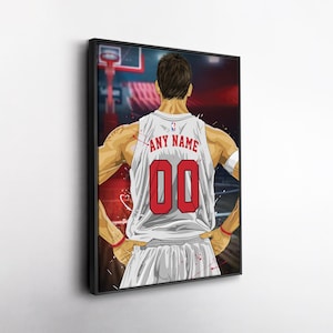 May include: Framed artwork of a basketball player from the back, wearing a white jersey with the text "ANY NAME" and the number "00" in red. The player is standing on a basketball court. The artwork is in a black frame.
