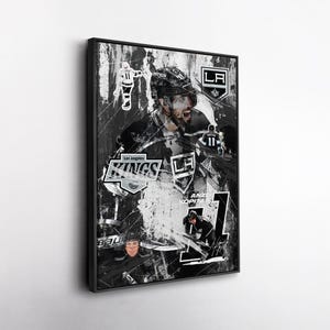 May include: Black and white framed art print featuring a collage of Los Angeles Kings hockey imagery. The artwork includes player portraits, team logos, and the text "Los Angeles Kings" and "Anze Kopitar". The overall design has a distressed, vintage aesthetic.