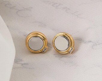 Pendientes circulares de dos tonos: oro y plata con circonitas talla baguette