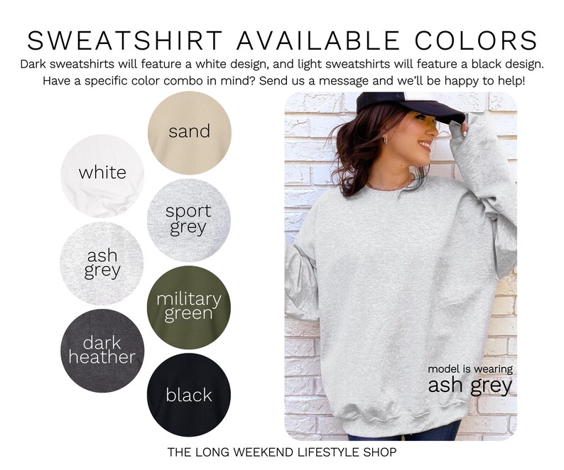 May include: A light grey sweatshirt is shown, with a model wearing the ash grey color. The image displays a color chart with options including white, sand, sport grey, military green, dark heather, and black. Text reads "SWEATSHIRT AVAILABLE COLORS".