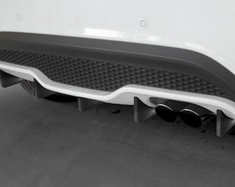 May include: A white car with a black rear diffuser and two exhaust pipes. The diffuser has a honeycomb pattern and a small spoiler.