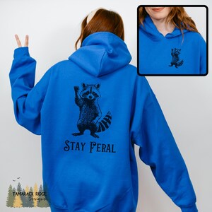 Stay Feral Hoodie Raccoon Sweatshirt Funny Racoon Hoodie Trash Panda Hoodie Feminist Protest Hoodie Unisex Graphic Hoodie Animal Lover Gift Royal