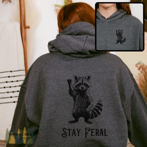 Stay Feral Hoodie Raccoon Sweatshirt Funny Racoon Hoodie Trash Panda Hoodie Feminist Protest Hoodie Unisex Graphic Hoodie Animal Lover Gift Dark Heather