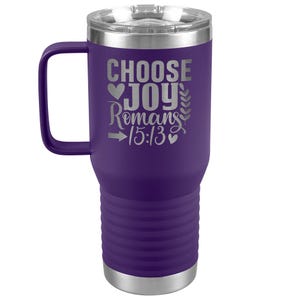May include: Purple stainless steel travel mug with a handle. The mug has a silver lid and the words "Choose Joy Romans 15:13" are engraved on the side.