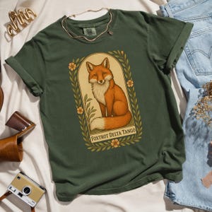Forest green Foxtrot Delta Tango shirt, botanical fox art, Comfort Colors anti-MAGA political graphic tee for progressive activists.