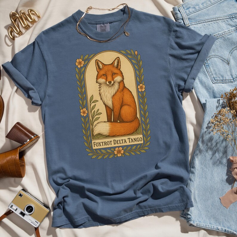 Blue Foxtrot Delta Tango Comfort Colors tee, hand-drawn fox with floral accents, witty political activist shirt for progressives.