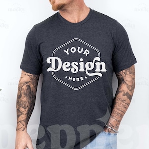 May include: A dark heather grey t-shirt with a white graphic design that says "Your Design Here" in a vintage font.