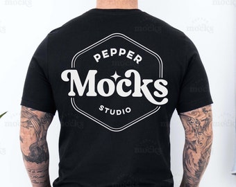 May include: A black t-shirt with a white graphic on the back. The graphic is a hexagon with the text "Pepper Mocks Studio" inside.