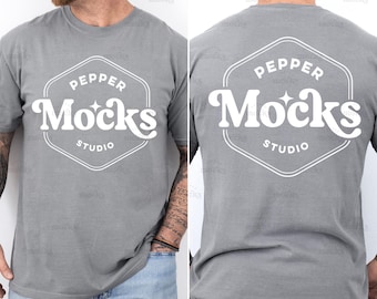 May include: A heather gray t-shirt with a white hexagonal logo that says "Pepper Mocks Studio" on the front and back.