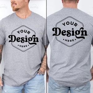 May include: A heather gray t-shirt with short sleeves and a crew neck. The front of the shirt has a black hexagon with the text "YOUR Design HERE" in a retro font. The back of the shirt has the same design.