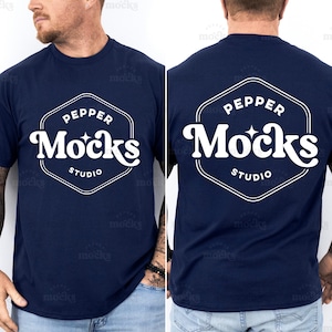 May include: A navy blue t-shirt with a white hexagonal logo that says "Pepper Mocks Studio" on the back and front.