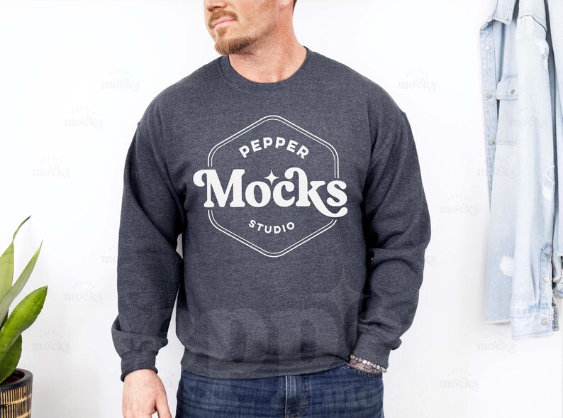 May include: A dark gray sweatshirt with a white logo that says "Pepper Mocks Studio" in a retro font.