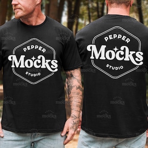 May include: Black t-shirt with the text "PEPPER Mocks STUDIO" in a white, stylized font within a white hexagonal frame. The shirt is short-sleeved and worn by a person. The back of the shirt also displays the same design.