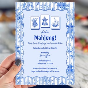 May include: A blue and white invitation for a Mahjong game night. The invitation features a decorative border with floral and pagoda designs. The text reads "Let's Mahjong!" with event details and RSVP information.
