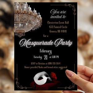 Black, white, and gold invitation card for a masquerade party. The card features a chandelier, a white mask, and a red rose. Text includes the party details: date, time, location, RSVP, and a dress code request. The invitation is held by a woman's hand.
Phantom of the Opera Digital Download Invitation for Opera Masquerade Invite Black Red Masquerade Valentine Party Idea for Black White Party