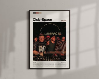 May include: Framed poster with the text "Club-Space Miami" above a photo of a DJ and a crowd. The word "CLUBSPACE" is in a circle. The DJ is wearing a football jersey. The poster has a black frame.