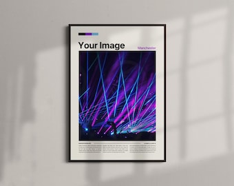 May include: Framed poster with a vibrant concert scene. The image features bright purple and blue stage lights illuminating a crowd. The poster has the text "Your Image" and "Manchester".