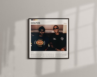 May include: A framed poster featuring two men in sunglasses. One wears a black Gucci sweatshirt, the other a black shirt. The poster has the word "GOLFOS" at the top, with text and the word "Milan" below the image.