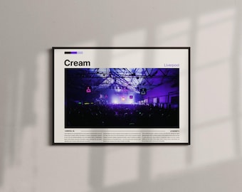 May include: Framed poster featuring a concert scene with a purple and white color scheme. The word "Cream" is at the top, with "Liverpool" to the right. The image shows a crowd of people in front of a stage with bright lights.