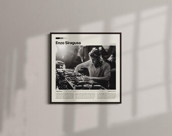 May include: Black and white framed print featuring a DJ at work. The print has the name "Enzo Siragusa" at the top, with the city "London" next to it. The image is set against a neutral wall.
