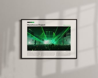 May include: Framed poster featuring a concert scene with green laser lights and a crowd. The poster has the text "Warehouse Project" and "Manchester" in a minimalist design. The frame is black, and the poster is displayed on a light gray wall.