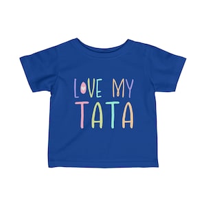 May include: A royal blue toddler t-shirt with the text "LOVE MY TATA" in rainbow colors.