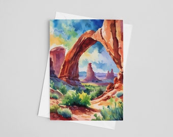 May include: A watercolour painting of a natural sandstone arch in a desert landscape. The arch is a vibrant orange and red colour, with a blue sky and clouds visible through the opening. The landscape is a mix of green vegetation and red rock formations.