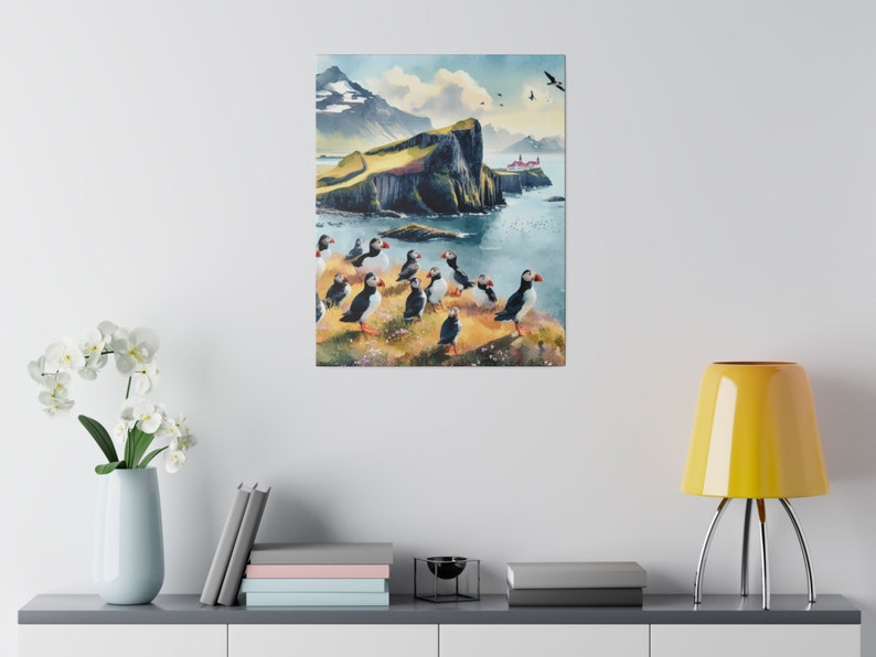 May include: A watercolor painting of a rocky cliffside with a small red building on top. The cliff is surrounded by water and there are many puffins standing on the rocks. The sky is blue and there are some clouds.
