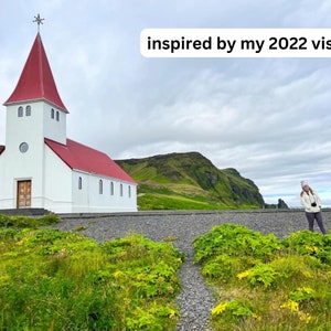 May include: A white church with a red roof stands against a green hillside. The church has a tall steeple and a single door. The sky is cloudy and gray. The text "inspired by my 2022 visit" is superimposed on the image.